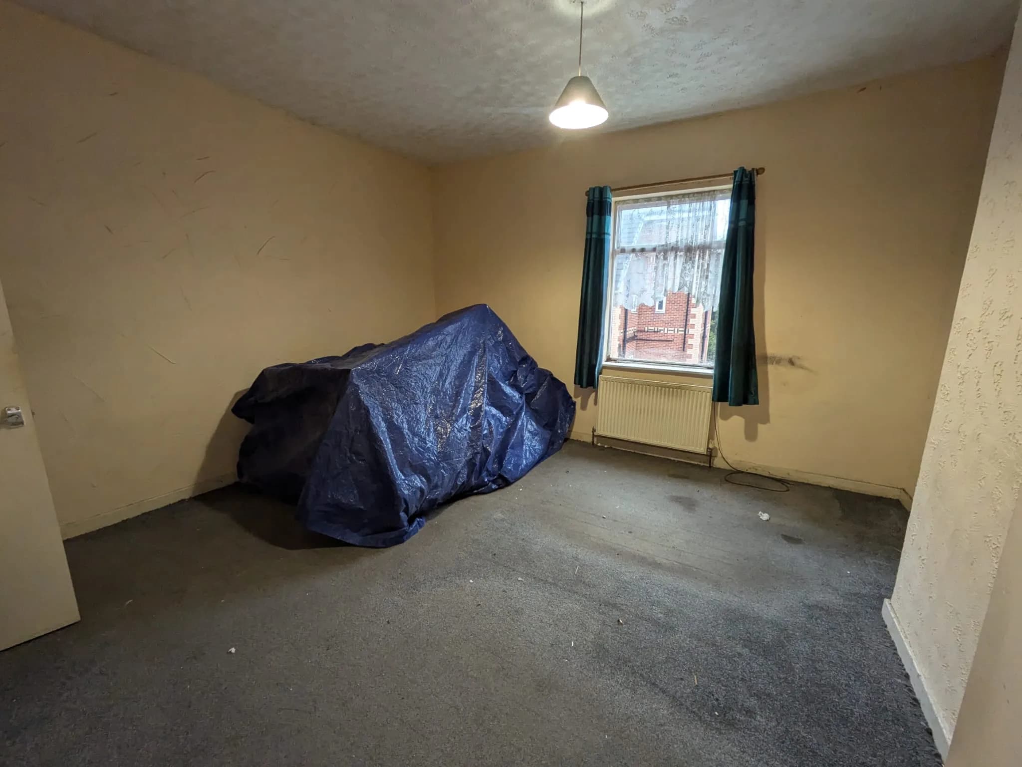 Room prepared for rewire with furniture protected